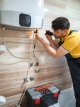 Engineer servicing a domestic boiler